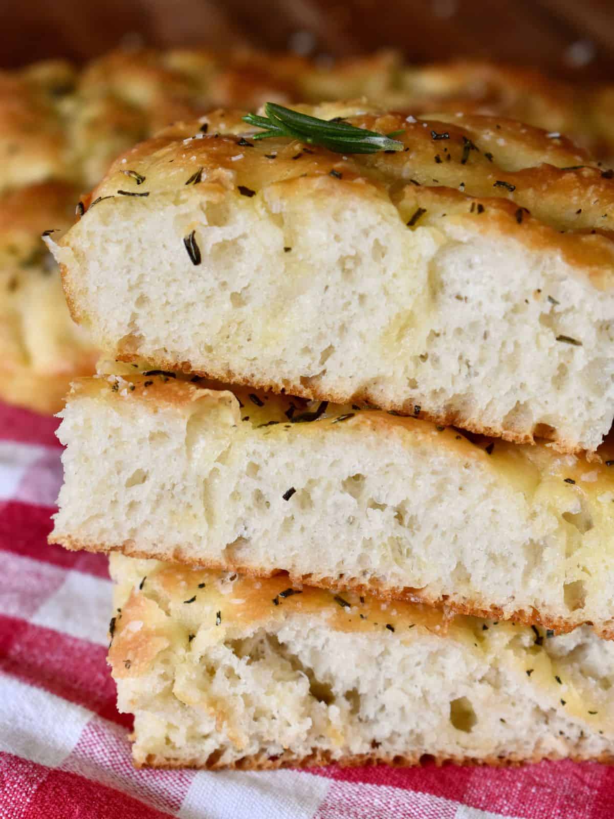 No Knead Focaccia Bread slices stacked on top of each other. 