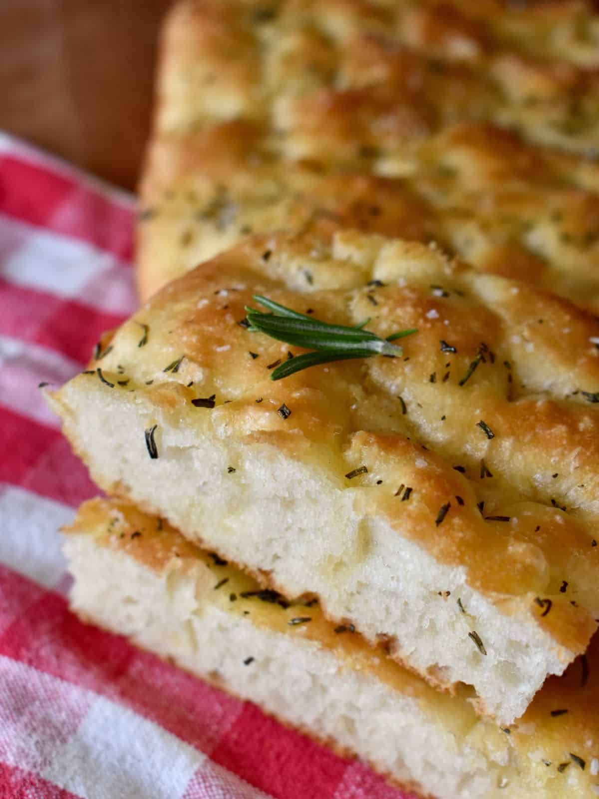 No Knead Focaccia Bread slices stacked on top of each other.