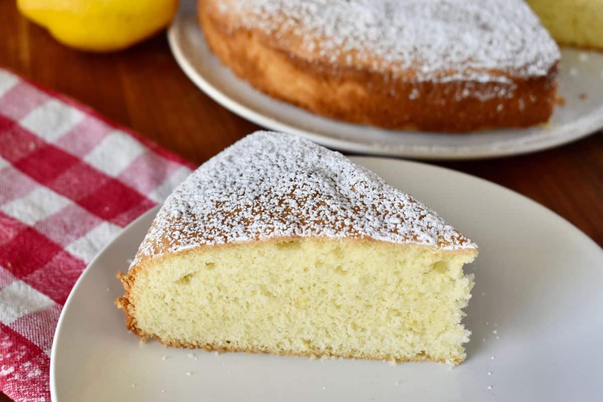 Slice of Italian torta paradiso on a white plate. 