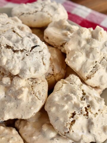 Brutti ma Buoni cookies stacked on a plate.