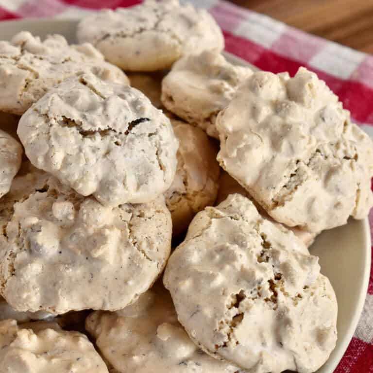 Brutti ma Buoni cookies stacked on a plate.