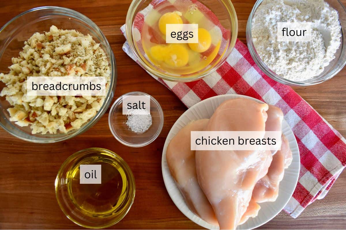 Ingredients including breadcrumbs, eggs, flour, salt, and olive oil. 