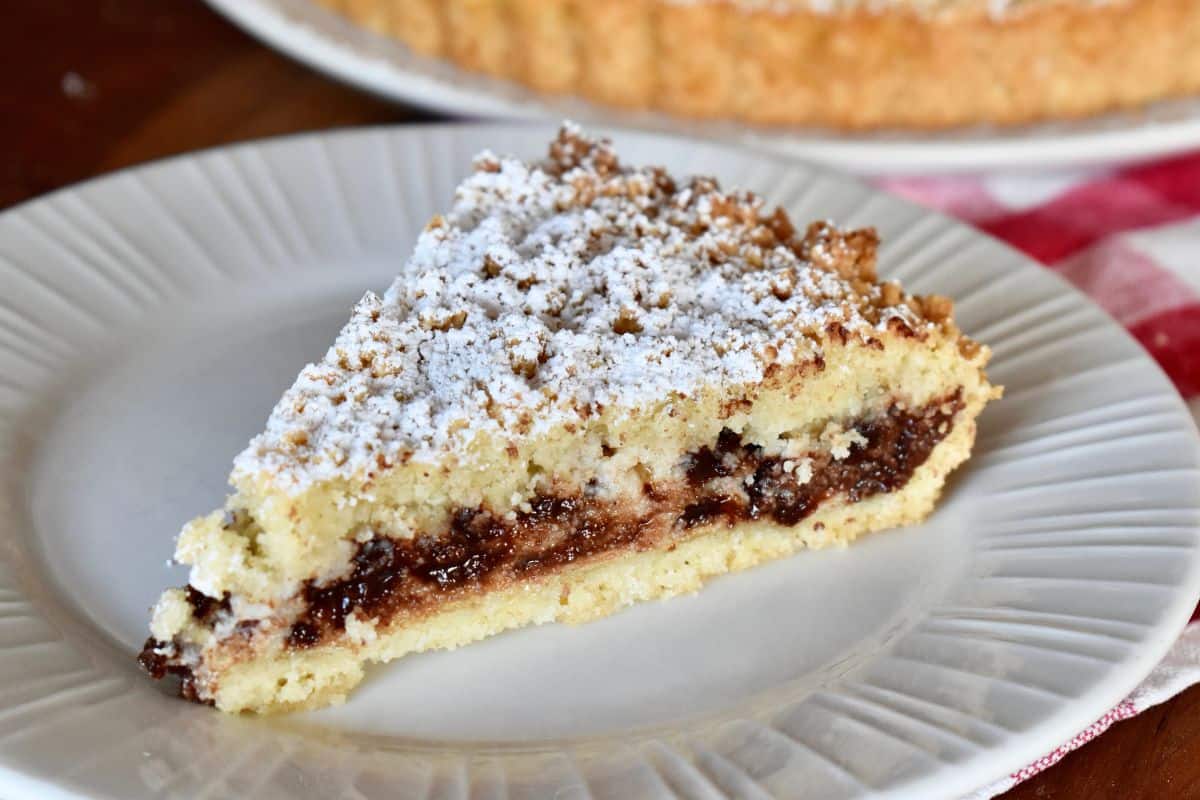 Ricotta Crostata slice on a white plate. 