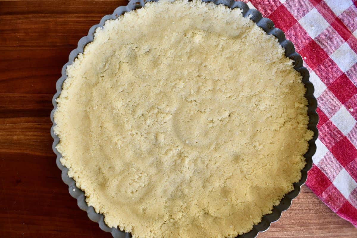 Pasta frolla crust press into a tart pan. 