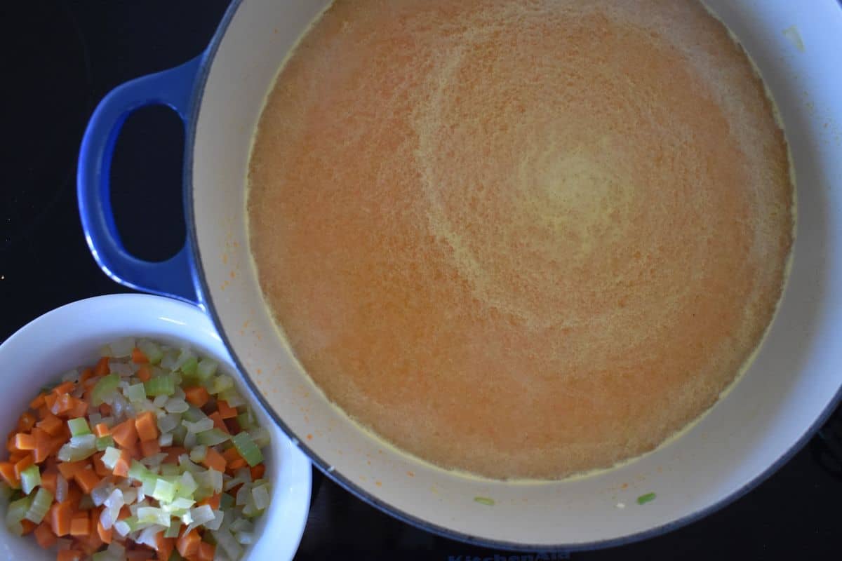 Pureed veggies and the broth in a dutch oven. 