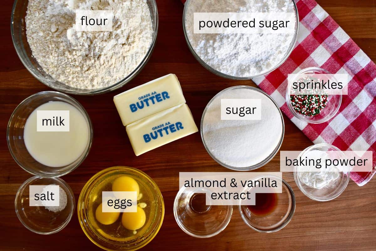 Ingredients include flour, butter, sugar, powdered sugar, eggs, and vanilla and almond extract. 