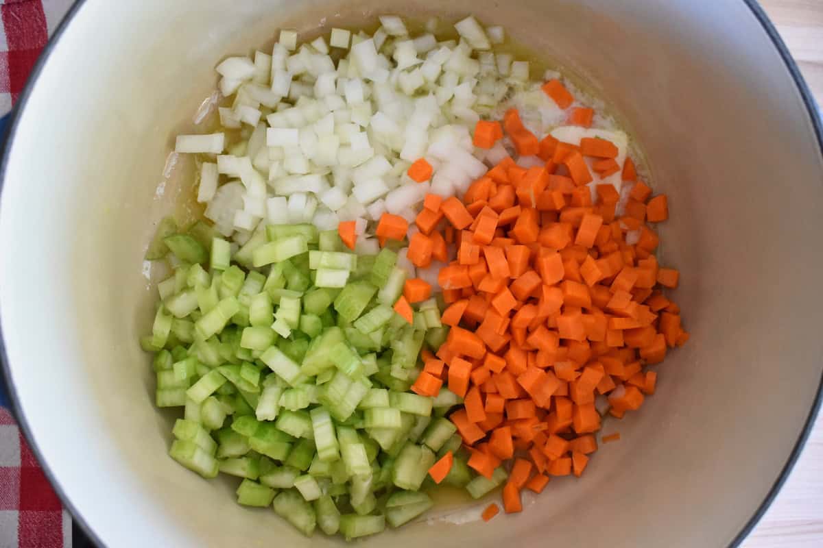 Onions, carrots, and celery in a large dutch oven. 