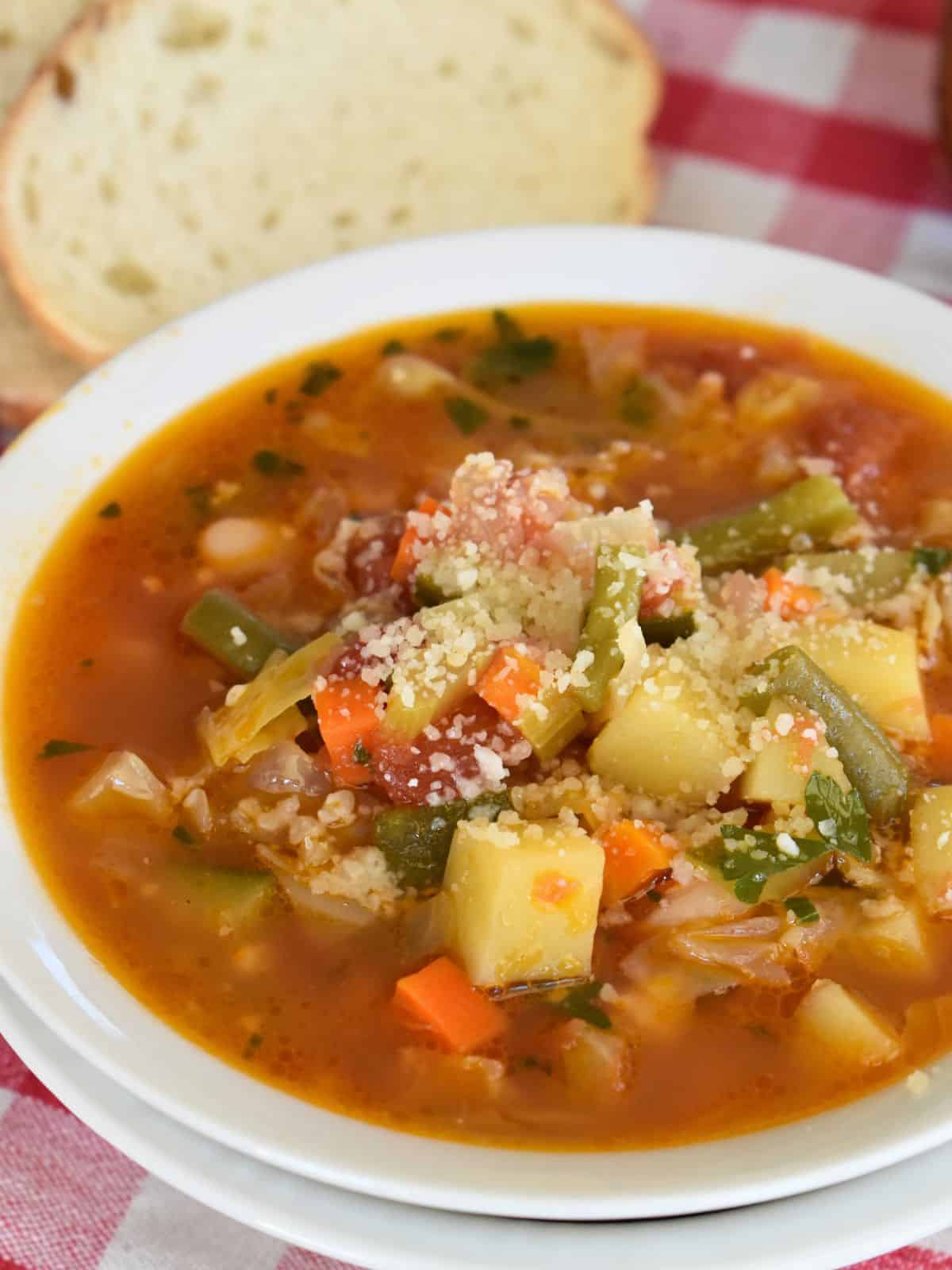 Italian Vegetable Soup in a white bowl. 