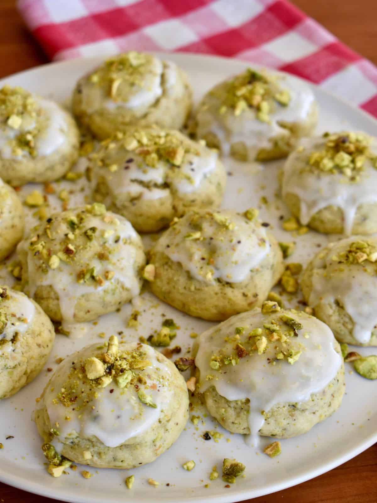 Pistachio Ricotta Cookies on a white plate. 