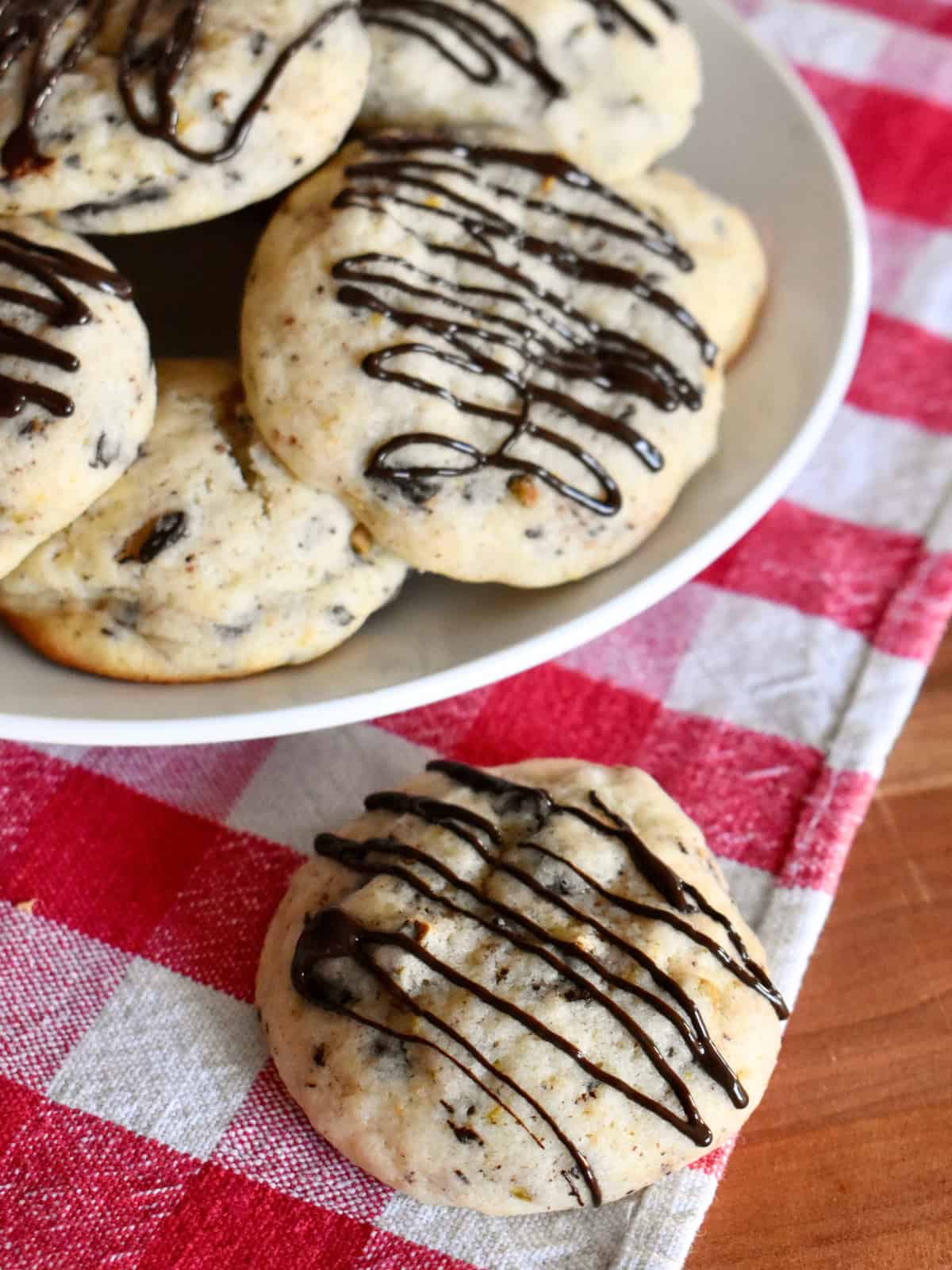 Cannoli Cookies with chocolate drizzle on top. 