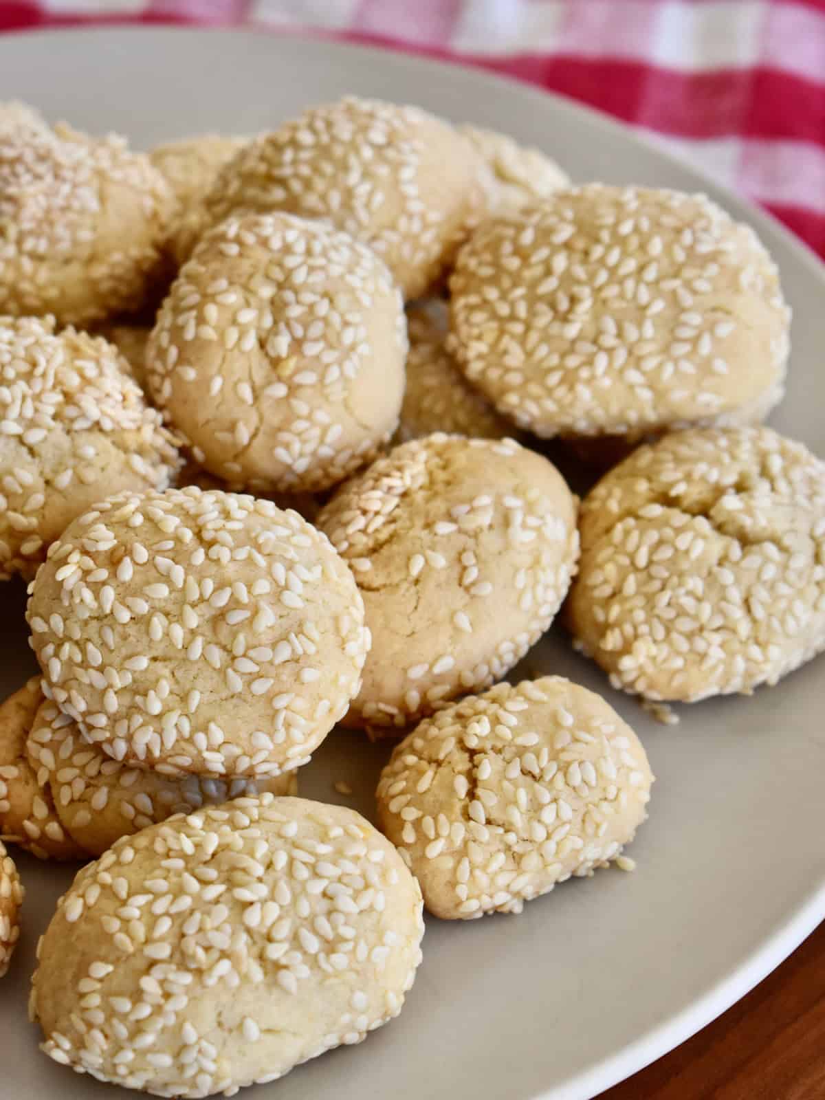 Stack of Italian Sesame Cookies on a white plate. 