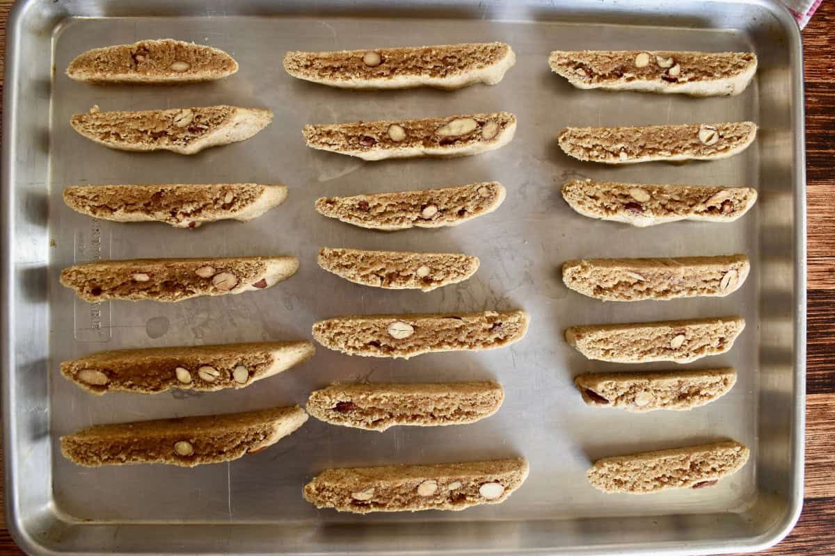 Whole wheat biscotti ready for second bake on a baking sheet. 