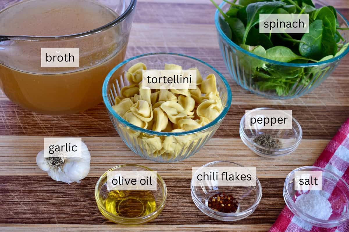 Ingredients include pasta, broth, spinach, garlic, and olive oil. 