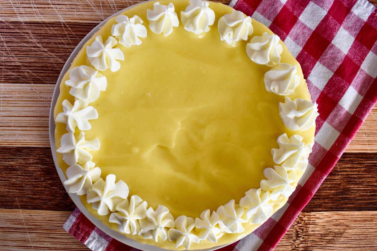 Lemon Ricotta Cheesecake with lemon curd topping and whipped cream. 