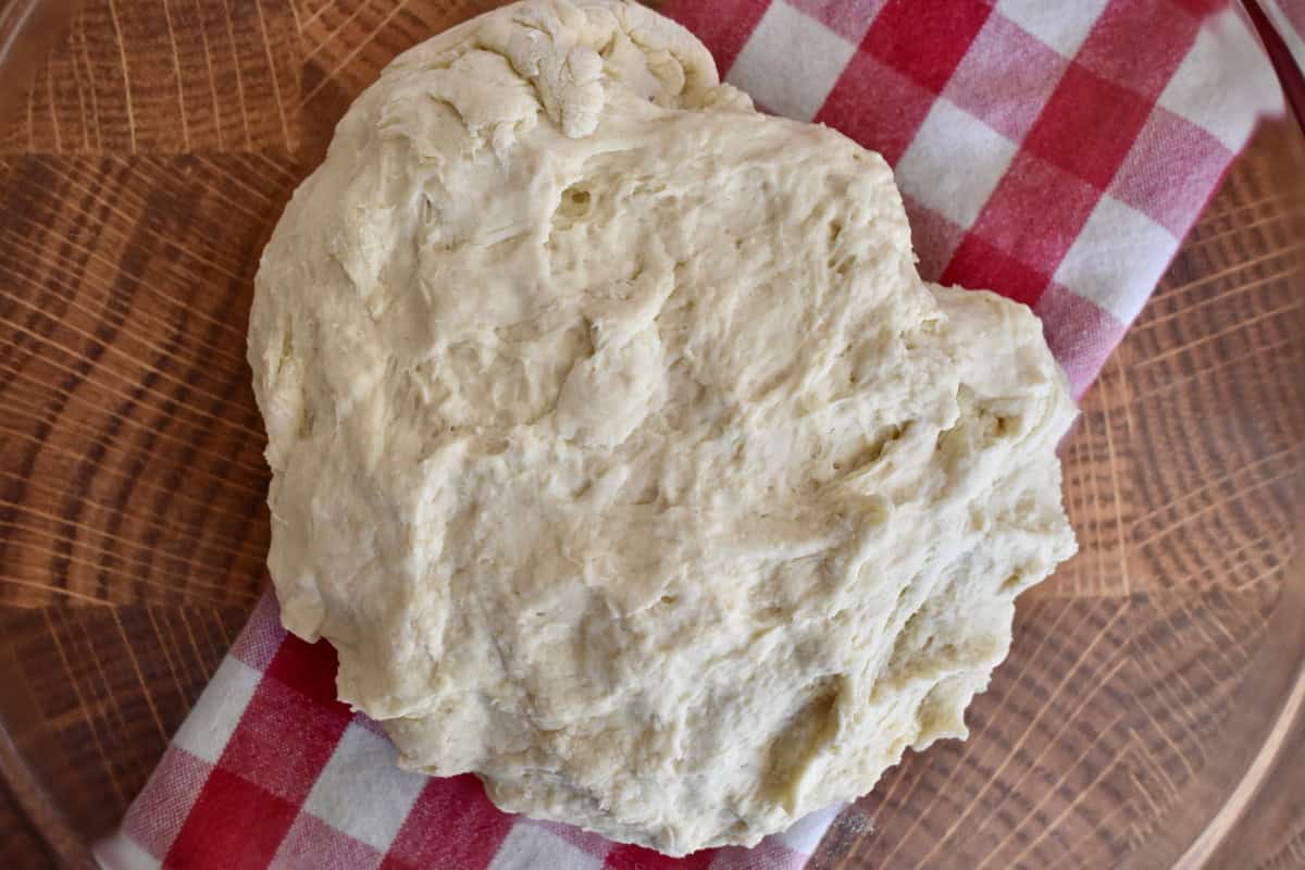Dough in a glass bowl. 