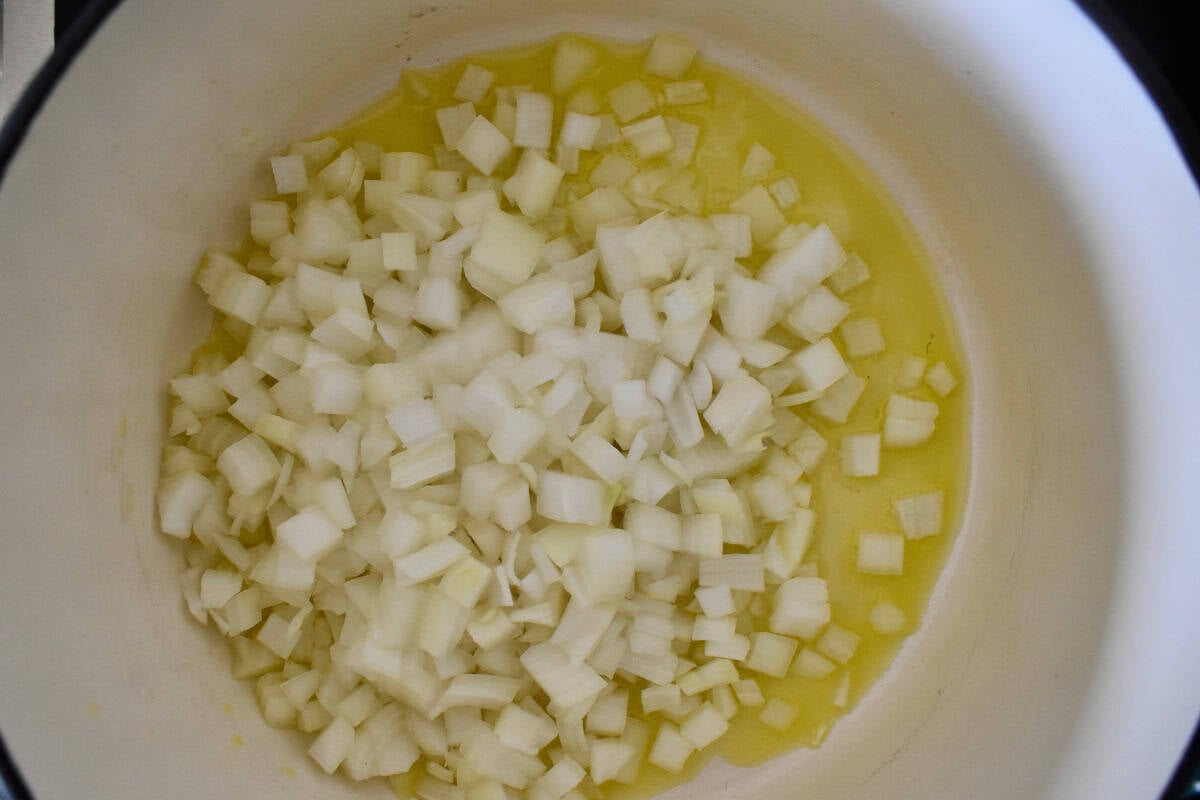 Onions simmering in olive oil in large dutch oven. 