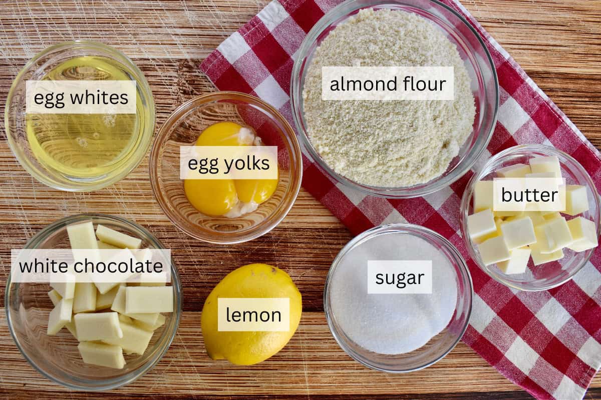 Ingredients for the recipe including almond flour, sugar, white chocolate, and butter.