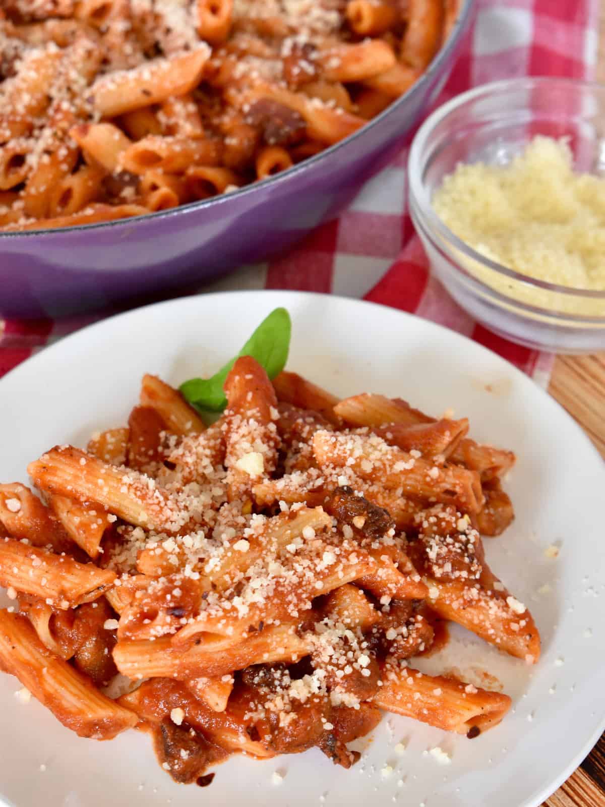 Penne all'Amatriciana on a white plate. 