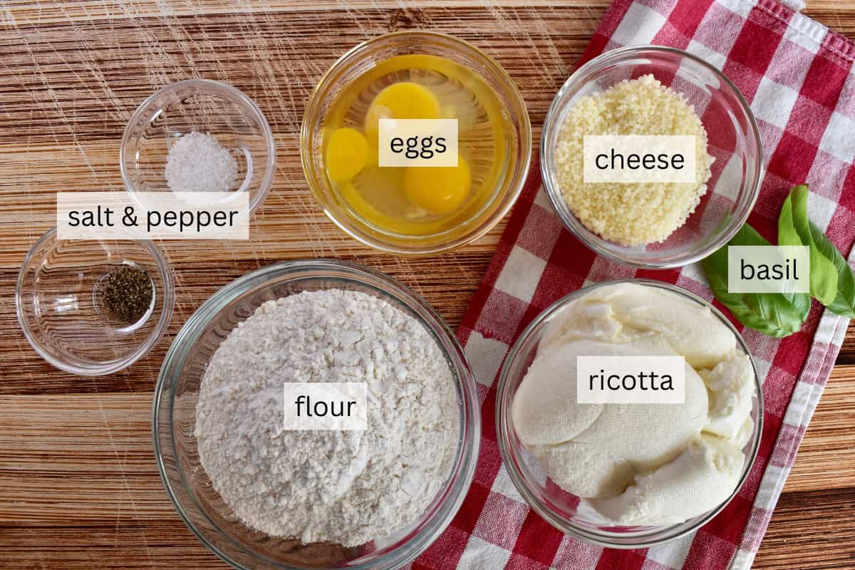 Ingredients for recipe including flour, eggs, and the cheese. 