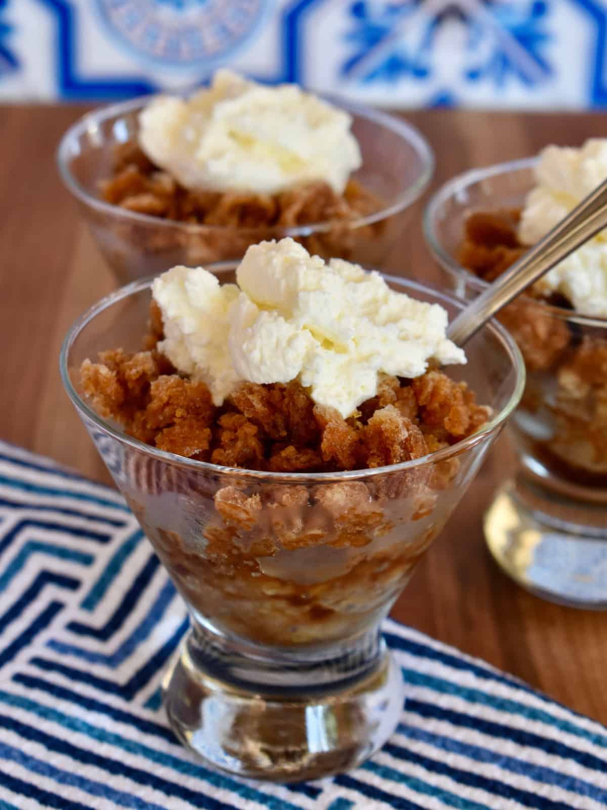 Espresso Granita in a glass cup with whipped cream on top. 
