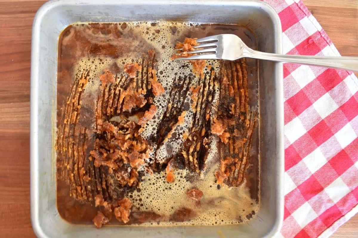 Frozen coffee mixture in baking pan scraped with a fork. 