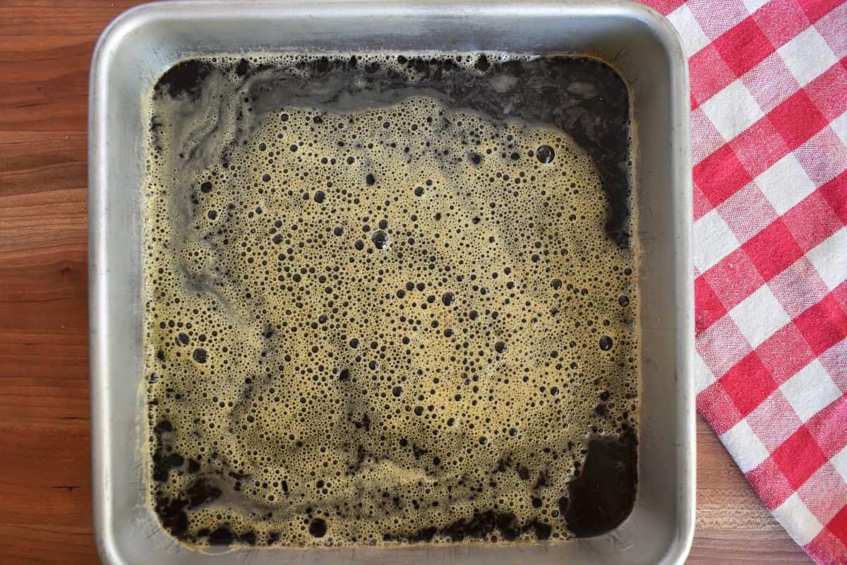Coffee and sugar in a square baking pan. 