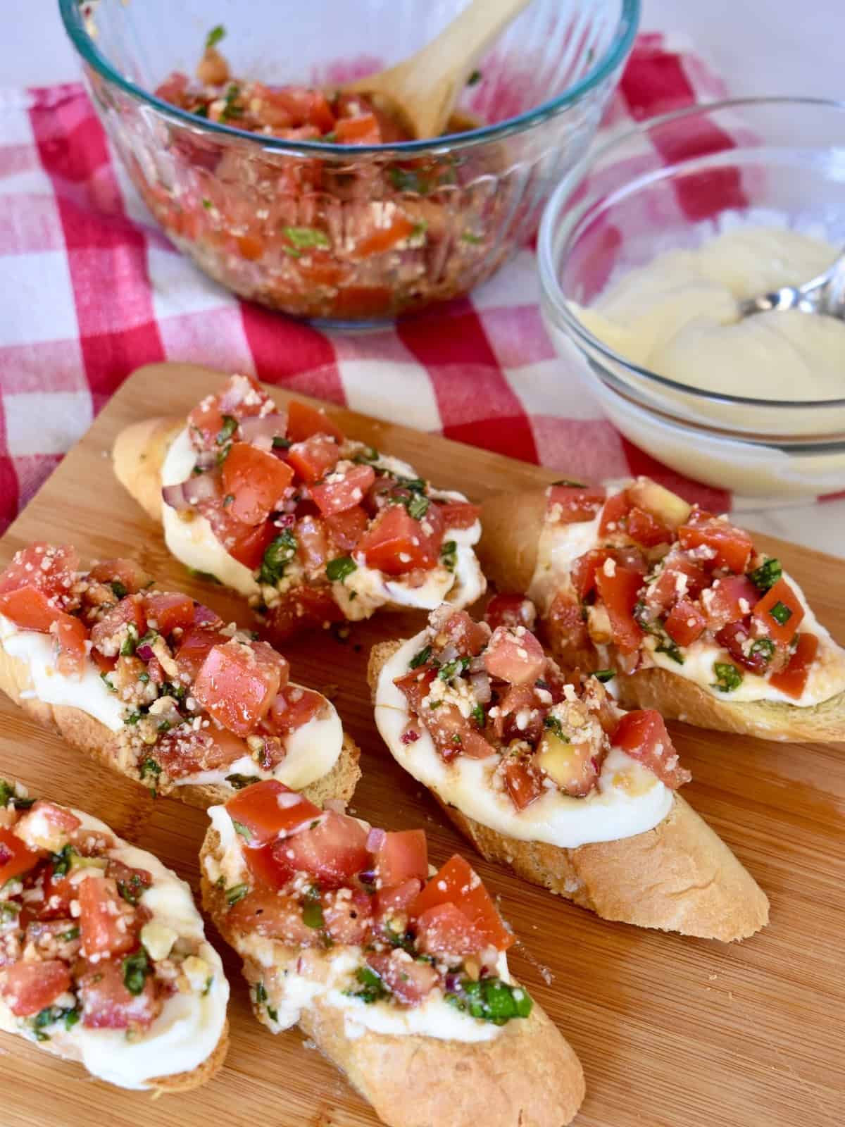 Ricotta Bruschetta on a wood cutting board. 
