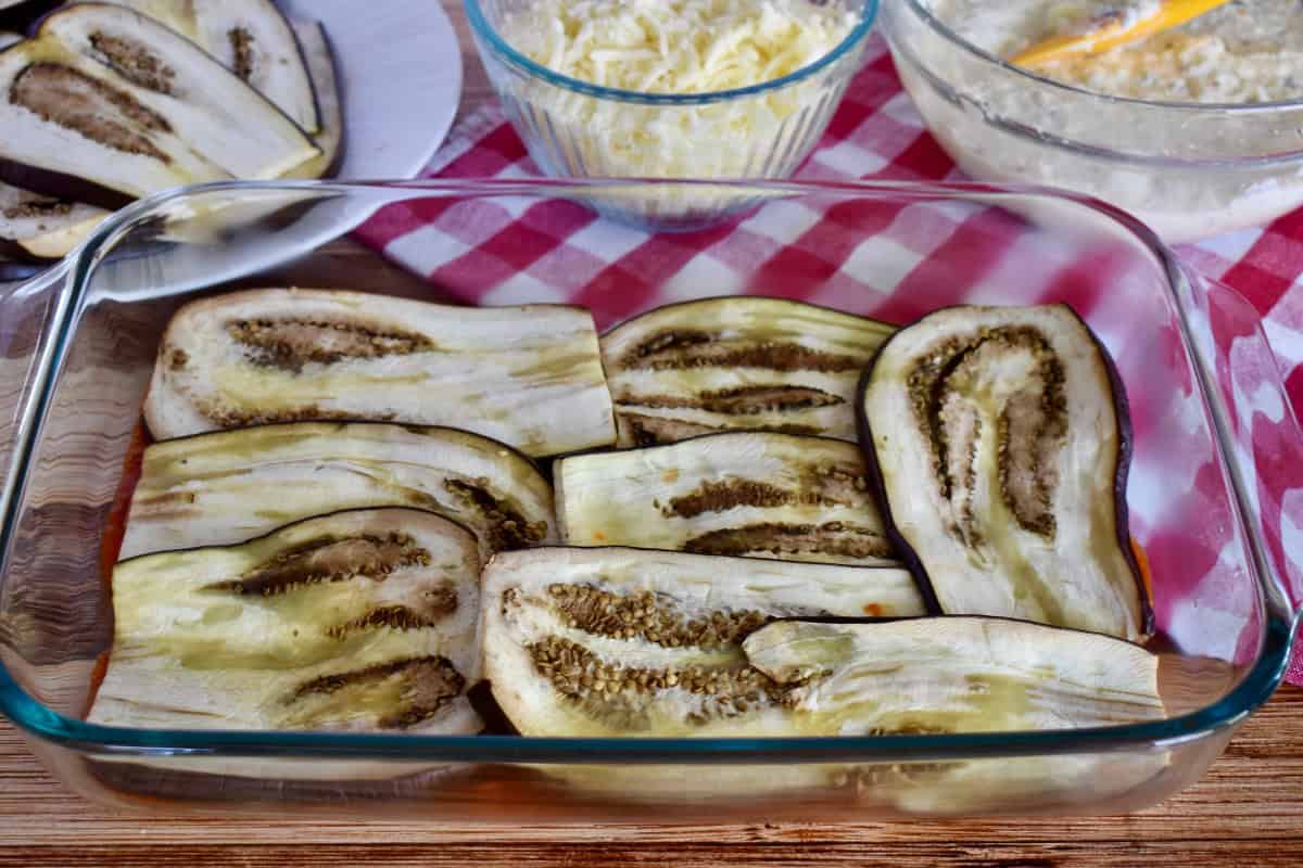 Layering eggplant in the baking dish. 