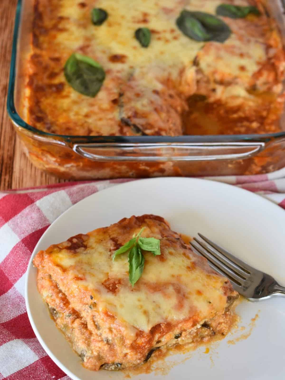 Slice of eggplant lasagna on a white plate. 