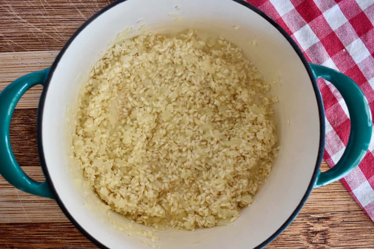 Toasted arborio rice in a dutch oven. 