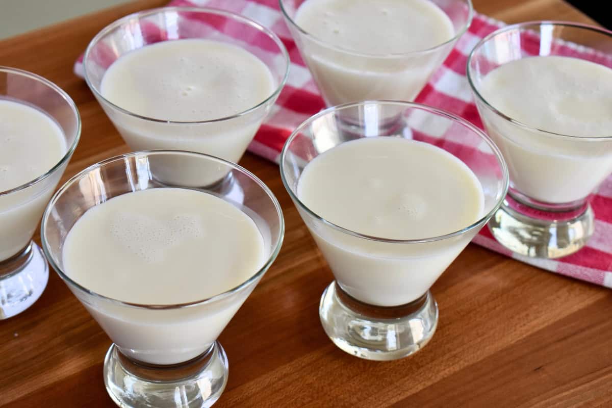 Panna Cotta mixture in six individual glasses. 