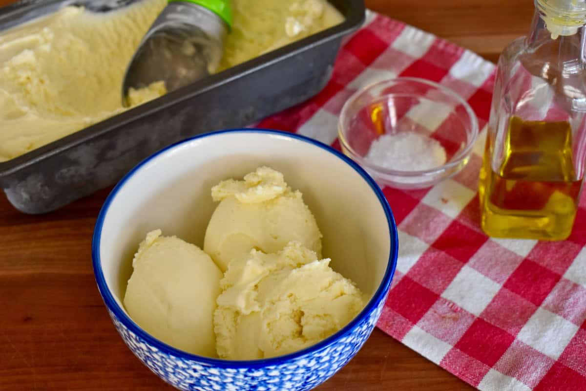 Olive oil gelato scooped into a bowl. 