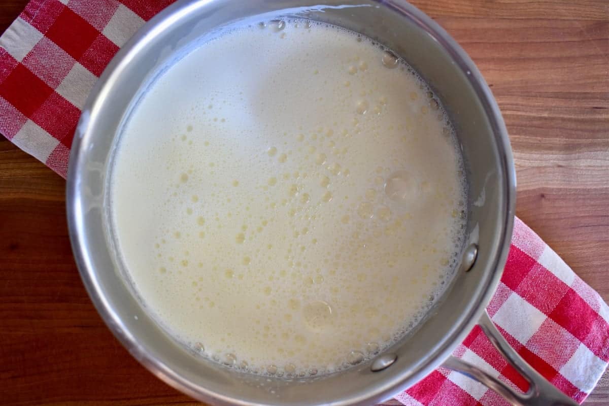 Hot milk in a saucepan. 