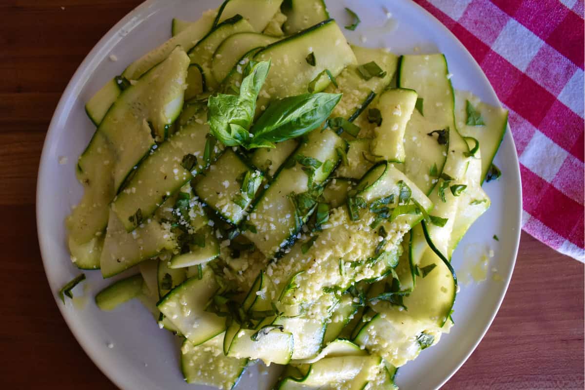 Zucchini Carpaccio on a white plate. 