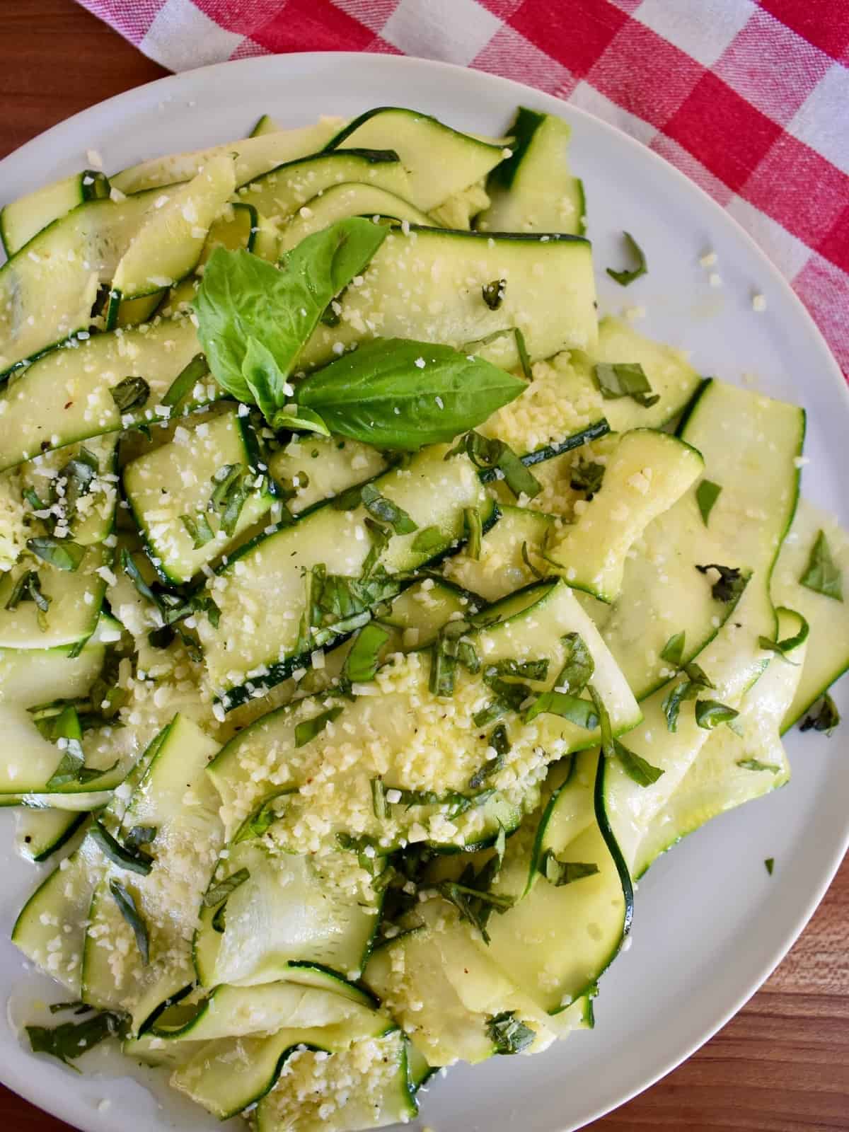 Zucchini Carpaccio on a white plate. 
