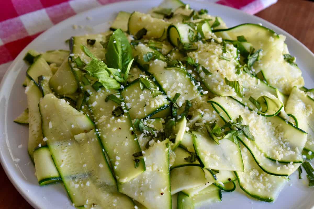 Zucchini Carpaccio on a white plate. 