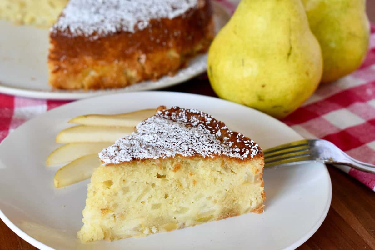 Pear Ricotta cake slice on a white plate. 