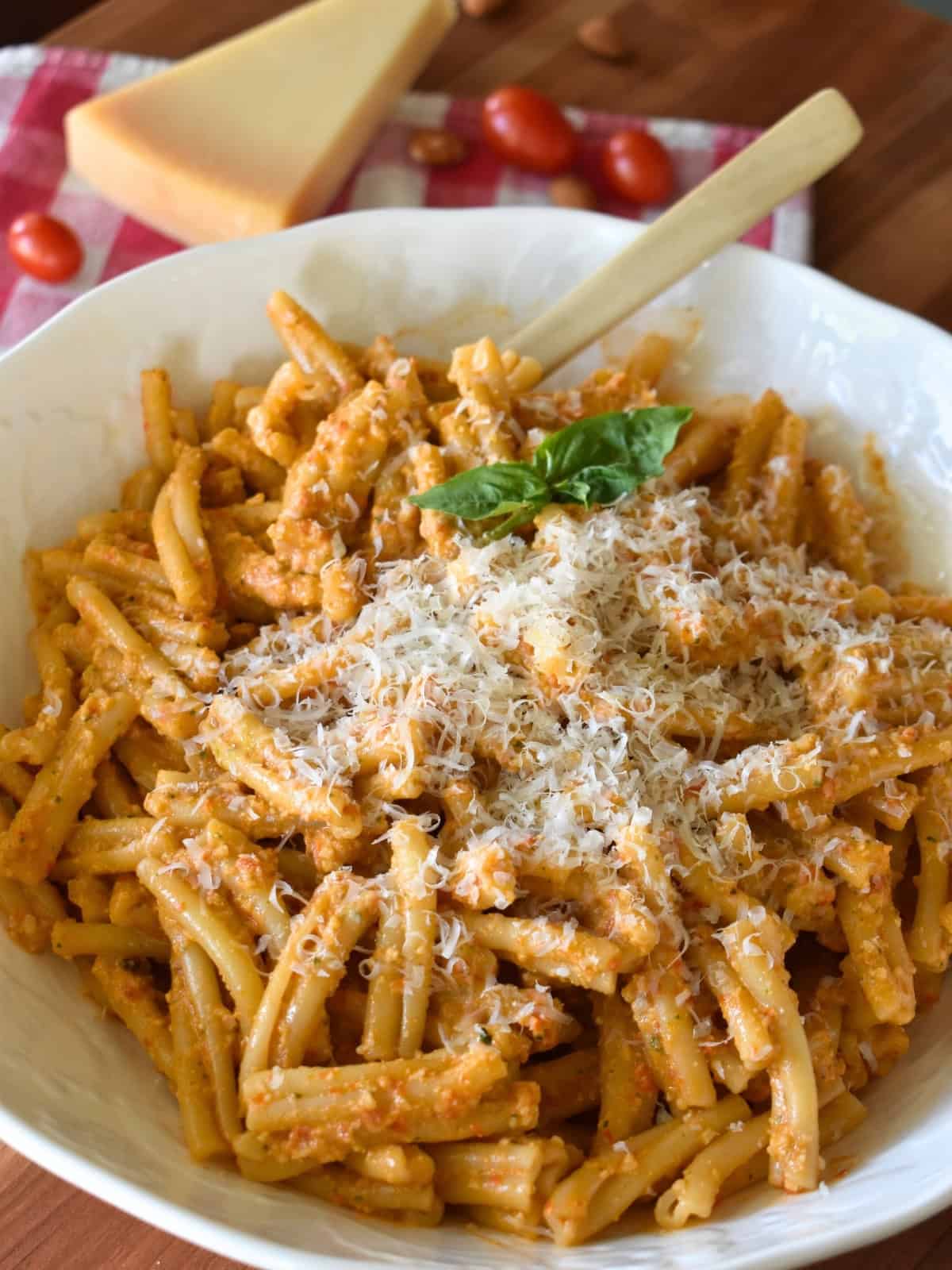 Sicilian pesto tossed with pasta in a white bowl. 