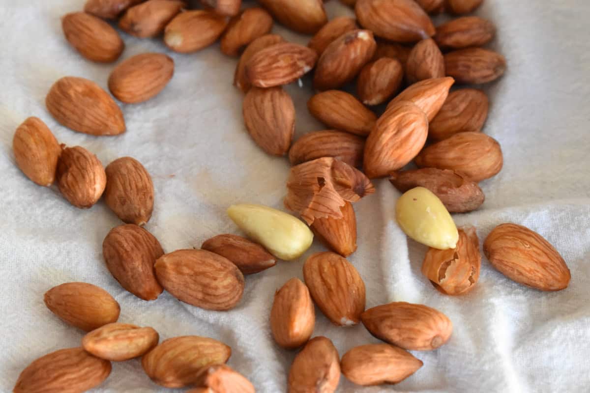 Boiled almonds on a towel with skins removed. 