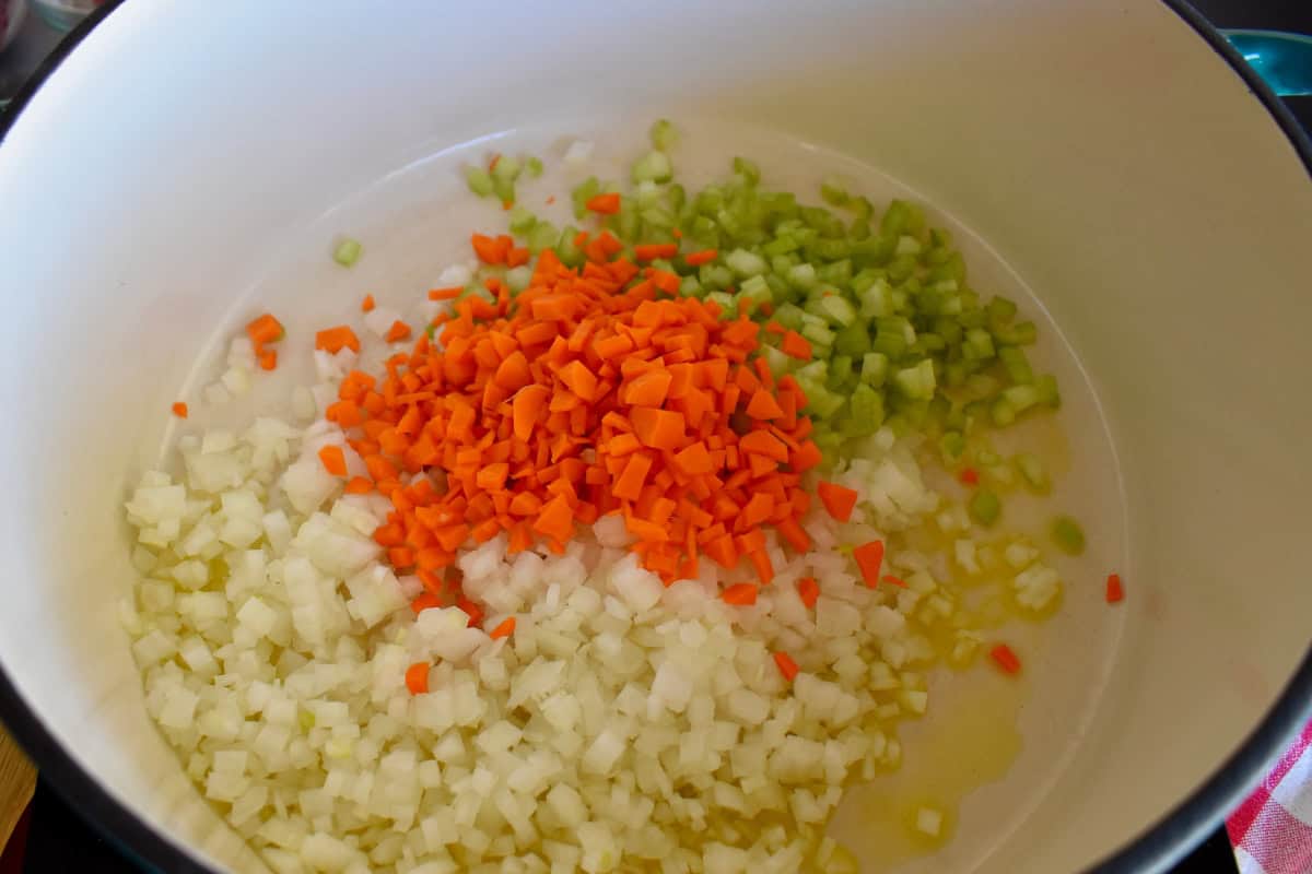 Diced onions, carrots and celery in a large dutch oven. 