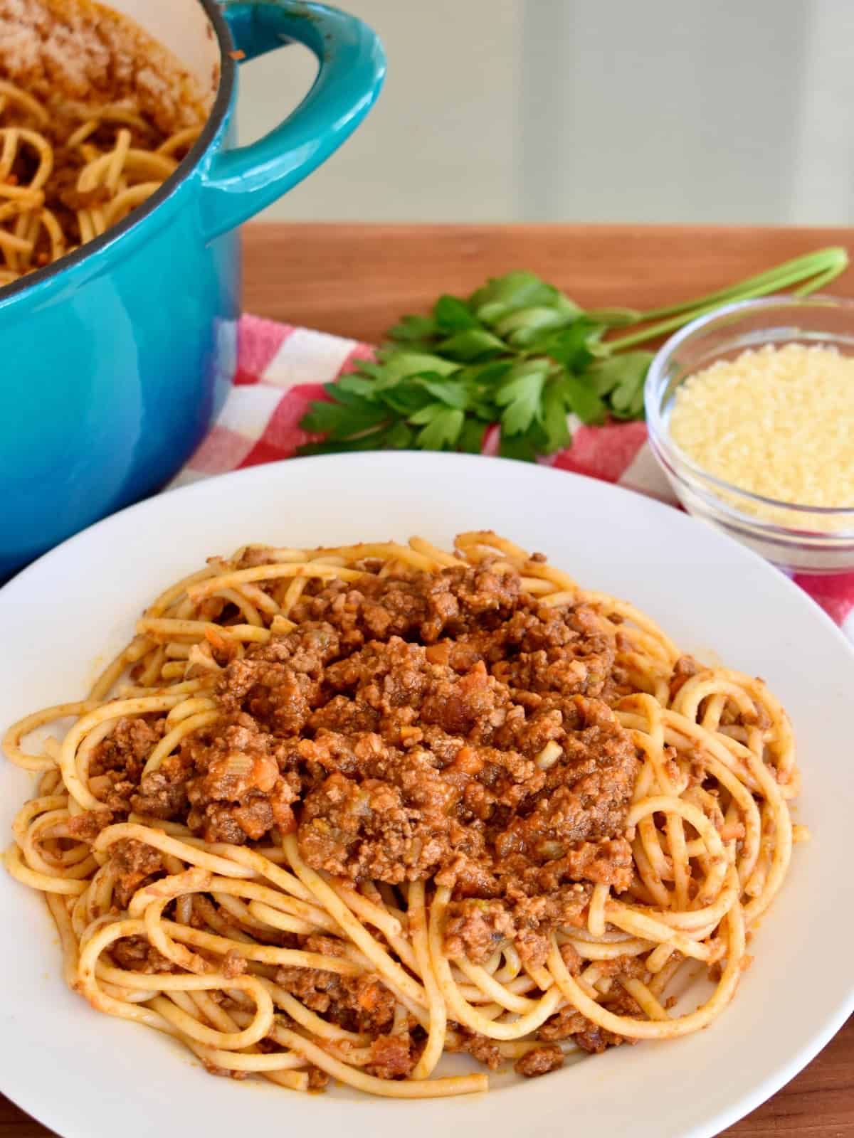 Authentic Bolognese Sauce with pasta in a white bowl. 