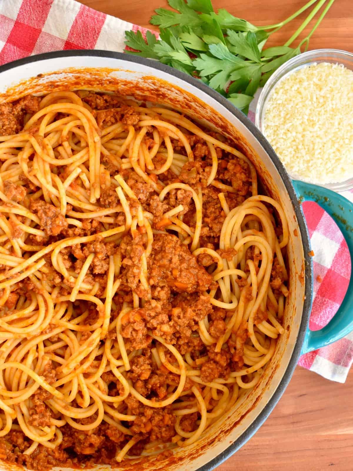 Authentic Bolognese Sauce with spaghetti in a large dutch oven. 