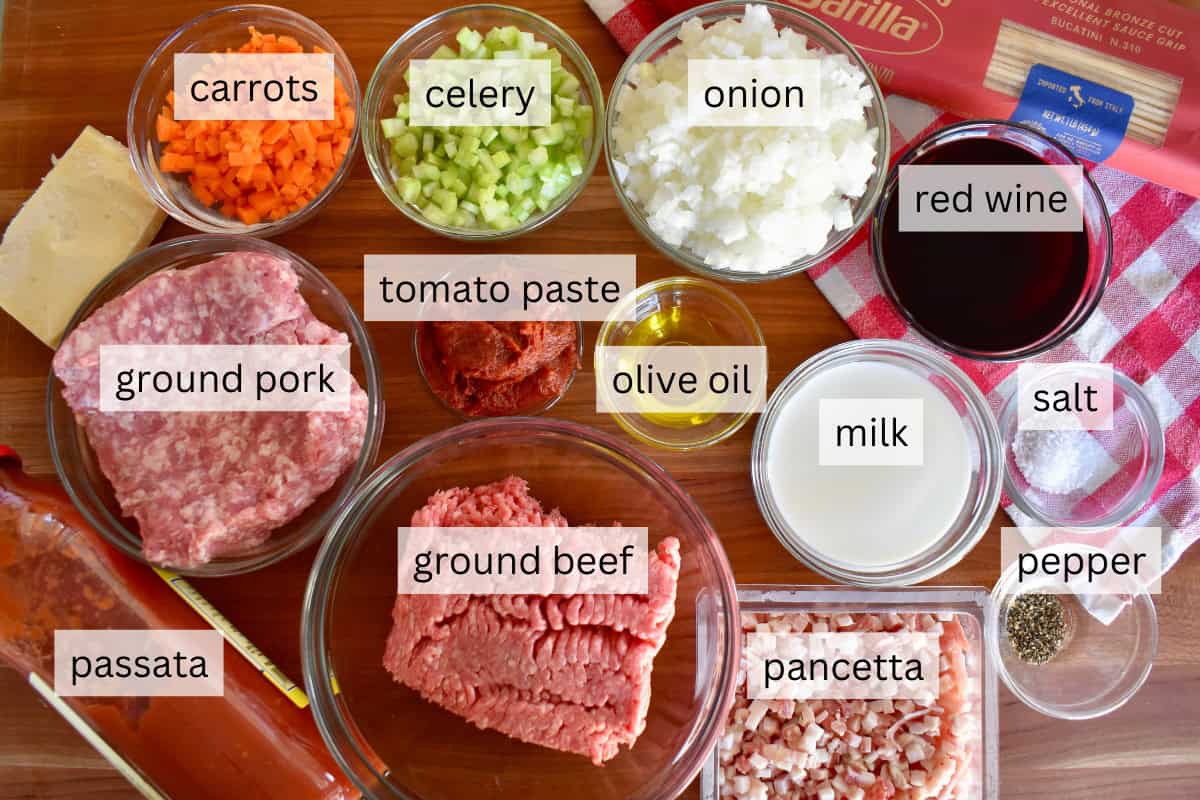 Ingredients for recipe include ground pork, beef, pancetta, red wine, and veggies. 